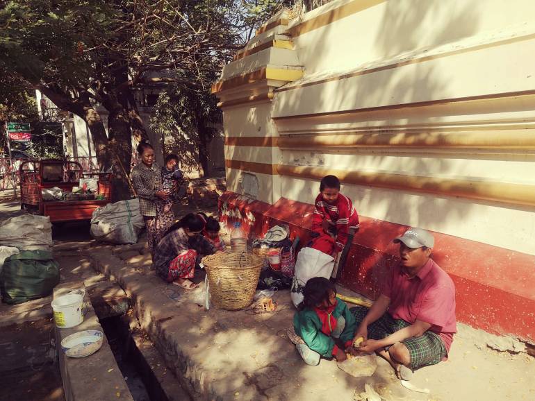 Nay Aung and Khin Mar Oo’s family collects garbage for daily living on the 24th street in Mandalay, Myanmar. Nay Aung is raising five children, instilling a sense of hard work and honesty in them. 